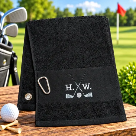 Schwarzes Golfhandtuch mit Initialen H. W. in Weiß bestickt