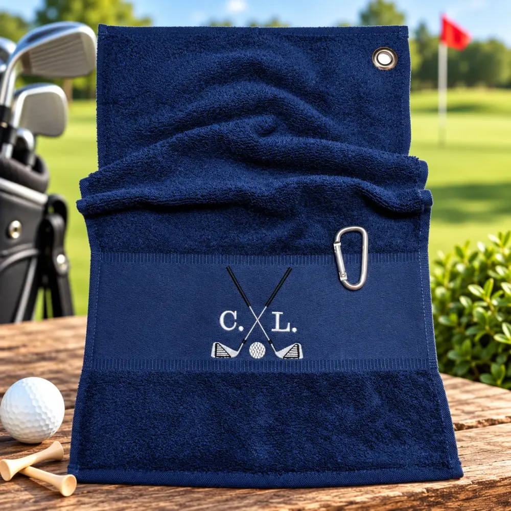 Marineblaues Golfhandtuch mit Initialen C. L. in Weiß und Golfmotiv bestickt