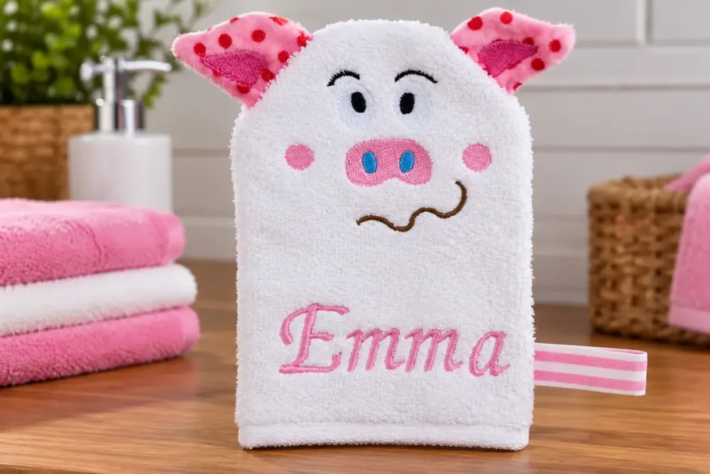 Weißer Waschhandschuh mit rosa Schweinchen, gepunkteten Ohren und gesticktem Namen Emma